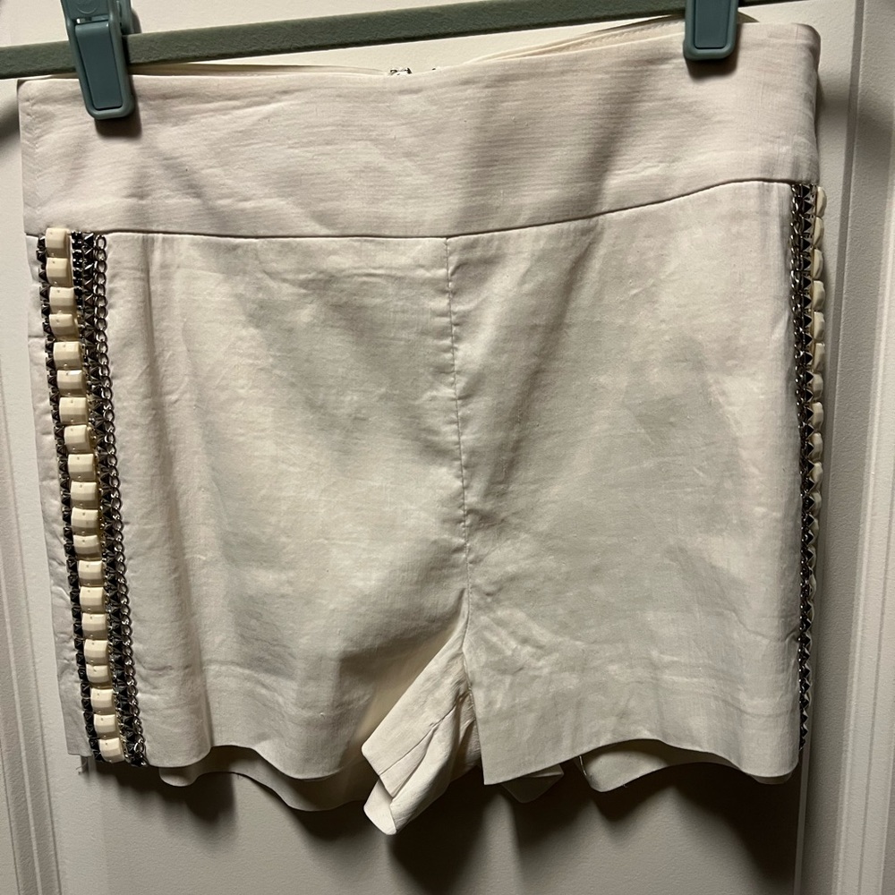 Bebe white embellished zip back shorts